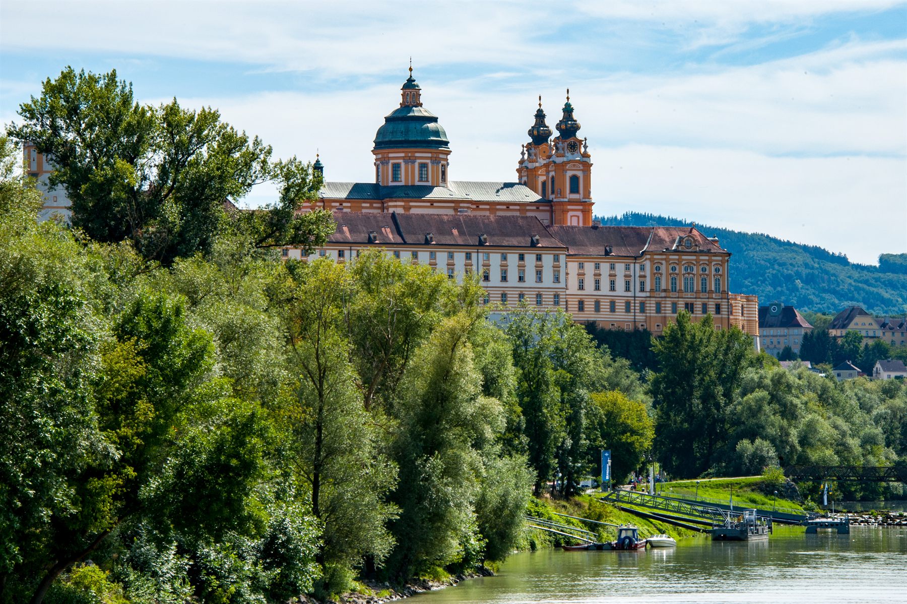 Melk Abbey rising above trees on the Danube in the Wachau Valley, Austria